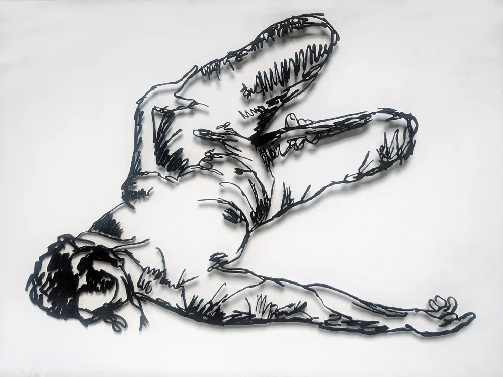 Metal sketch of a model in a reclined pose